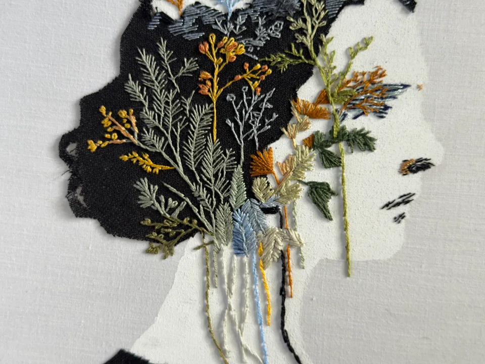 Close detail of leaves, stems, and flowers in the botanical portrait
