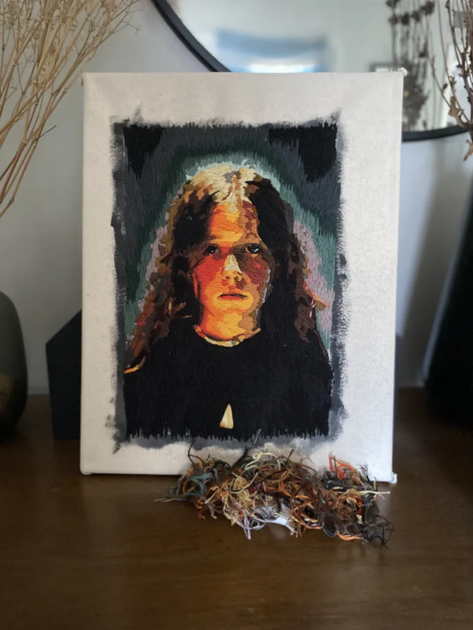 Of Youth, a colorful needle-painted portrait on cream canvas