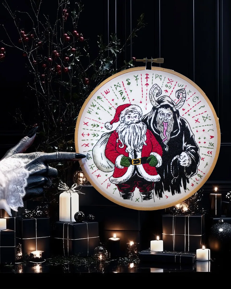 Santa and Krampus hand embroidery in a round hoop
